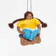 GIF 360 degree view of girl reading  a book ornament.  featured in Reading-themed gift bundle featuring four handmade wool felt ornaments—a gnome reading a book, a lion with glasses holding a book, a young girl reading, and a fairy with wings reading—alongside a coordinating stationery set. Stationery includes a notepad, four illustrated notecards with envelopes, and four colorful bookmarks, all featuring characters from the Reading Collection. Ornaments are made from natural merino-blend wool and come read