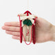 Our Red Flyer Sled Ornament captures the nostalgia of childhood winters and treasured holiday traditions. Inspired by classic wooden sleds, this charming keepsake features bright red runners, a cozy neutral-toned seat embroidered with "Flyer," and a festive holly sprig nestled beneath a soft white bow.