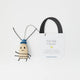 The one New York City roach you'll actually want to take home! Meet our Roach Bag Charm, a cheeky little tribute to the city that never sleeps and its most infamous residents. Created in collaboration with Roaches of NYC, the whimsical world of artist JG Debray, this lovable little city slicker is ready to crawl into your heart and tag along on all your urban adventures