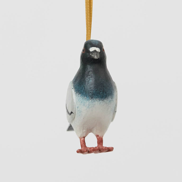 A hand-painted Rock Dove Pigeon Ornament, handmade in the Philippines with softly shaded details and a satin hanging ribbon.


A familiar city friend takes on old-world charm in our Rock Dove Pigeon Ornament. 