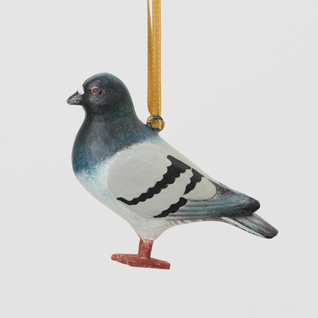 A hand-painted Rock Dove Pigeon Ornament, handmade in the Philippines with softly shaded details and a satin hanging ribbon.


A familiar city friend takes on old-world charm in our Rock Dove Pigeon Ornament. 
