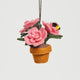 Delicately stitched wool ornament featuring blooming garden roses in a felt pot, accented by two bees—ideal for flower lovers and botanical holiday trees