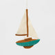 Set sail for holiday memories with our handcrafted Sailboat Ornament, a charming tribute to life on the water. Featuring crisp white sails, a warm wood-toned mast and deck, and a sea-glass-inspired turquoise hull, this classic sailboat captures the quiet beauty of coastal living and the freedom of open water.