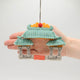 Felt Chinatown Gate ornament with embroidered dragons and jade roof, handmade by Kyrgyz artisans. Perfect Lunar New Year décor honoring Chinese tradition.

