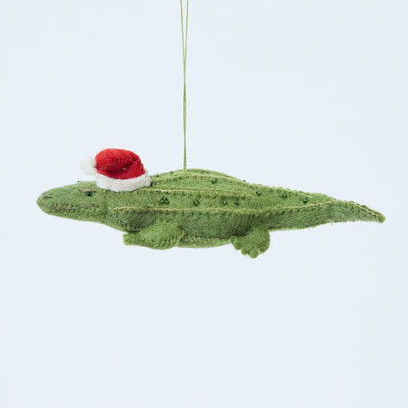 Craftspring’s Santa Alligator Ornament — felt alligator with a beautiful face and embroidered and beaded back ridges — heirloom-quality Christmas ornament, perfect for holiday gifting, ethically crafted by artisans using sustainable wool.