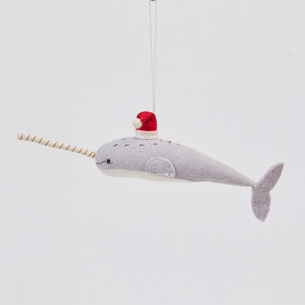 Handmade felt Santa Gray-Blue Narwhal ornament from Craftspring, featuring intricate beaded and embroidered details and a red Santa hat—heirloom-quality Christmas decor, ethically crafted by artisans using sustainable wool.