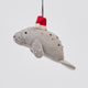 Handmade felt Santa Manatee ornament from Craftspring, featuring a red Santa hat and intricate beaded and embroidered details—heirloom-quality Christmas decor, ethically crafted by artisans using sustainable wool.