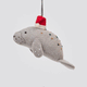 Handmade felt Santa Manatee ornament from Craftspring rotating to show front, side, and back views—highlighting the red Santa hat and detailed beadwork and embroidery, sustainably crafted by artisans.