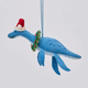 Handmade felt Santa Plesiosaurus ornament from Craftspring rotating to show front, side, and back views—featuring a dinosaur with a Santa hat, festive wreath, and intricate beaded and embroidered details, showcasing heirloom quality and artisan craftsmanship, ethically crafted using sustainable wool.