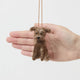 Celebrate the one-of-a-kind charm of man’s best friend with our felt Scruffy Mutt Ornament. Handcrafted by skilled artisans, this adorable pup features a tousled coat, floppy ears, and a sweet, soulful expression that captures the personality of beloved mixed-breed dogs everywhere.