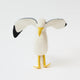 Let your holiday décor take flight with our handcrafted Seagull Tree Topper, a whimsical coastal alternative to the traditional star or angel. With wings fully outstretched, bright yellow legs, and classic black-tipped feathers, this charming seabird captures the freedom and beauty of life by the ocean.