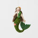 Add a touch of ocean magic to your Christmas tree with our beautiful Siren Mermaid Ornament. Lovingly handcrafted from eco-friendly wool felt, this elegant mermaid features flowing brunette hair, a vibrant green tail adorned with sparkling bead accents, and charming floral details inspired by the treasures of the sea.