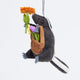 Hand-felted skunk ornament holding basket of felt flowers – handmade wool woodland decoration from the Gardening Collection.