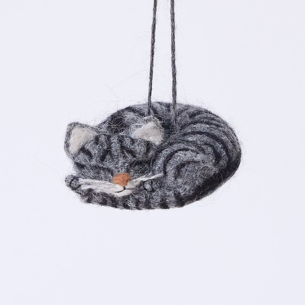 Handmade needle-felted Sleepy Gray Cat Ornament from Craftspring, with whiskers and a cute face—adorable Christmas decor, ethically crafted by artisans using sustainable wool.