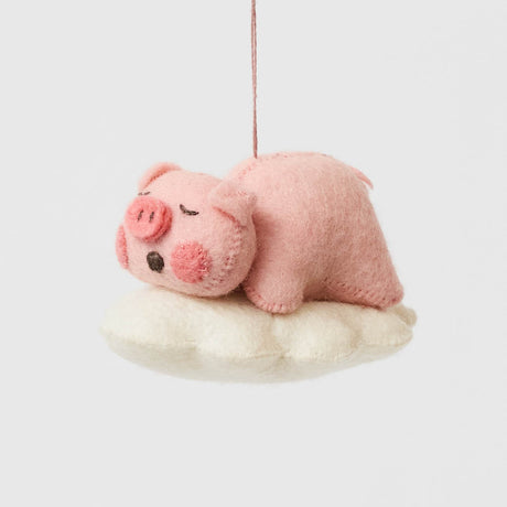 Sweet and serene, this adorable pig ornament rests peacefully on a soft felted cloud, capturing the gentle calm of a sleeping baby - irresistibly cute.&nbsp; With its rosy cheeks, tiny snout, and closed eyes, it brings a sense of warmth and quiet charm to any nursery or holiday setting. So cute it will make you squeal.&nbsp;