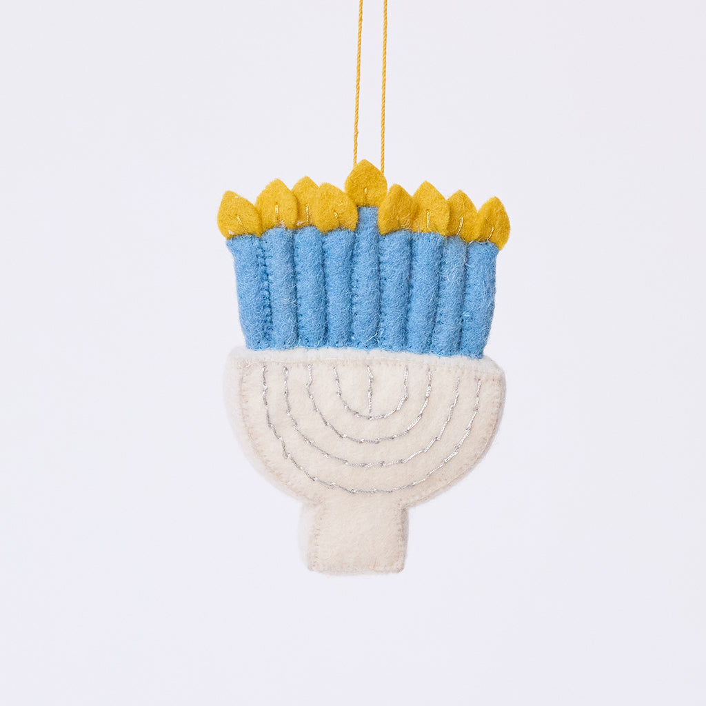Handmade felt Small Silver Menorah ornament from Craftspring, featuring silver embroidery, blue candles with twinkling flames, and a white menorah base — heirloom-quality Hanukkah and holiday decor, ethically crafted by artisans using sustainable wool.