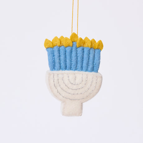 Handmade felt Small Silver Menorah ornament from Craftspring, featuring silver embroidery, blue candles with twinkling flames, and a white menorah base — heirloom-quality Hanukkah and holiday decor, ethically crafted by artisans using sustainable wool.