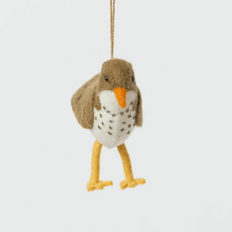 Bring a touch of the shoreline to your holiday décor with our delightful Spotted Sandpiper Ornament. Carefully handcrafted from eco-friendly wool felt, this charming bird captures the distinctive features of the beloved sandpiper, from its warm brown plumage and bright orange beak to its delicate spotted breast.