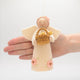 Handmade Spring Angel ornament holding baby chicks – a symbol of renewal and hope for Easter or springtime décor.