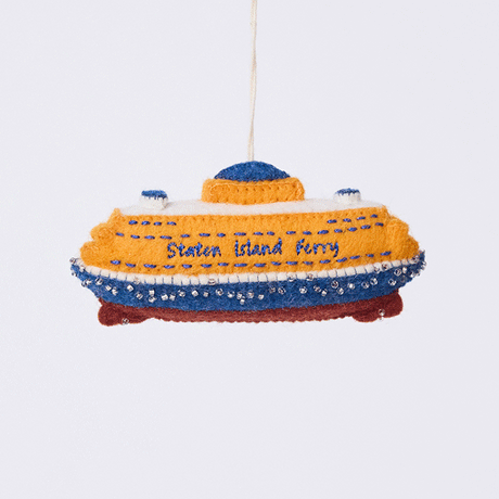Handmade felt Staten Island Ferry ornament from Craftspring rotating to show front, side, and back views—featuring intricate embroidered details and beaded waves, showcasing the iconic orange ferry, ethically crafted by artisans using sustainable wool.