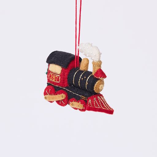 Craftspring’s Steam Engine Train Ornament rotating to show front, side, and back views — felt black and red train with gold embroidery and beading, fluffy steam, and a wreath on the back, a playful ornament perfect for holiday gifting — heirloom-quality Christmas decor, ethically crafted by artisans using sustainable wool.