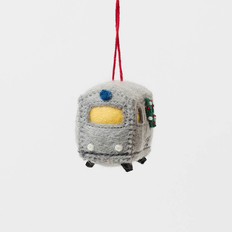 Celebrate the rhythm of New York City with our handmade NYC Subway Train Car Ornament, a charming felt keepsake inspired by the iconic subway cars that keep the city moving.