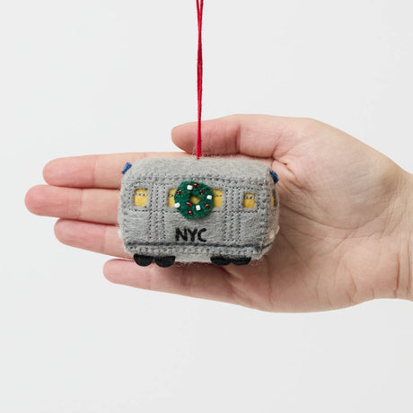 Celebrate the rhythm of New York City with our handmade NYC Subway Train Car Ornament, a charming felt keepsake inspired by the iconic subway cars that keep the city moving.