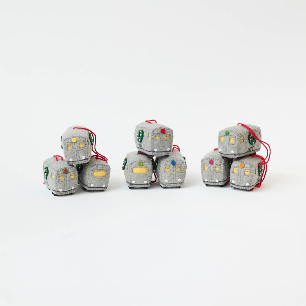 Celebrate the rhythm of New York City with our handmade NYC Subway Train Car Ornament, a charming felt keepsake inspired by the iconic subway cars that keep the city moving.