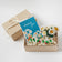 Thanks Gift Box Set featuring a felt strawberry ornament, white daisy flower bouquet in a glass vase, and a thank-you bouquet greeting card. Handmade from wool felt. Eco-friendly, fair trade, and ready to gift.