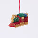 Craftspring’s Toy Train Ornament — felt red and green train with gold embroidery, intricately detailed with a team engine carrying presents and a teddy bear — heirloom-quality Christmas ornament, perfect for holiday gifting, ethically crafted by artisans using sustainable wool.