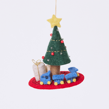 Craftspring’s Train Around the Christmas Tree Ornament rotating to show front, side, and back views — felt blue toy train wrapping around the base of a decorated Christmas tree with presents, a playful ornament perfect for holiday gifting — heirloom-quality Christmas decor, ethically crafted by artisans using sustainable wool.