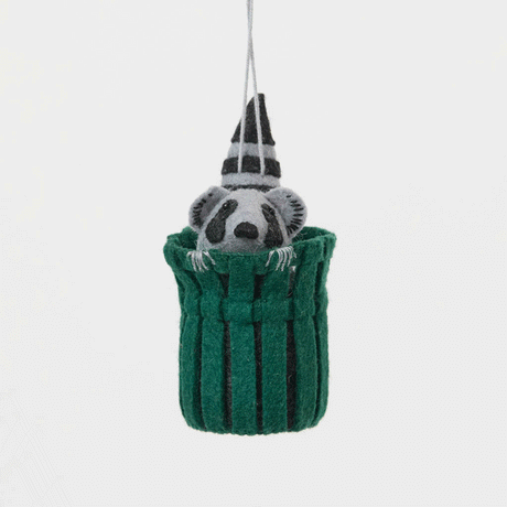 Every city has its unofficial mascot, and New York's just might be the mischievous raccoon. Meet our Trash Raccoon Ornament, peeking curiously from inside a classic green city trash can with the sweetest little face you've ever seen. Don't worry—this tiny trash panda is all charm and absolutely no trouble.