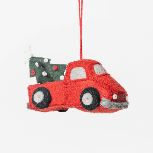 Craftspring’s Tree Farm Return Truck Ornament from the Christmas on the Farm Ornaments Bundle rotating to show front, side, and back views — felt truck carrying a Christmas tree in the back with beaded and embroidered details, a whimsical ornament perfect for holiday gifting — heirloom-quality Christmas decor, ethically crafted by artisans using sustainable wool.