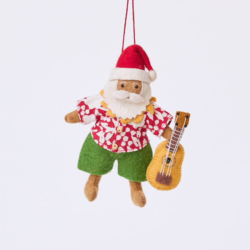 Handmade felt Tropical Santa Ornament from Craftspring, featuring Santa in a Hawaiian Aloha shirt holding a ukulele — festive heirloom-quality Christmas decor, ethically crafted by artisans using sustainable wool.