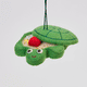 Handmade felt Turtle Sandbox ornament from Craftspring shown from front, side, and back views—with the turtle shell cover slightly open to reveal beaded sand, a bucket, mini shovel, and starfish—heirloom-quality summer decor, ethically crafted by artisans in India using sustainable wool.