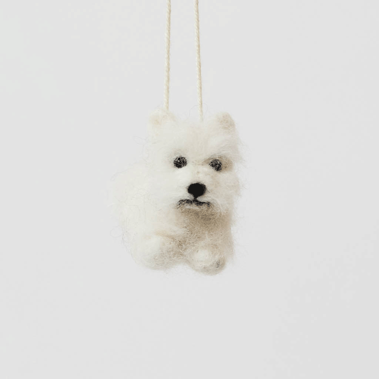 Full of personality and unmistakable charm, our alpaca&nbsp;Westie Ornament brings this beloved breed to life in soft, handcrafted detail. Carefully made by skilled artisans, this adorable pup features the Westie’s signature fluffy white coat, alert expression, and compact, sturdy stance.