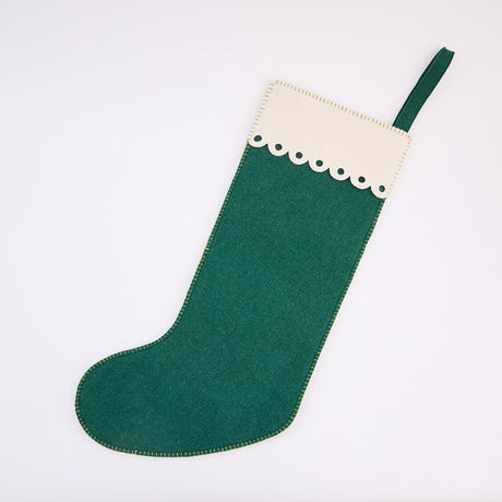 Back of Craftspring’s Woodland Stocking ornament, featuring intricate applique and embroidered details, including a cardinal sitting on a pine branch—heirloom-quality Christmas decor, ethically crafted by artisans using sustainable wool.