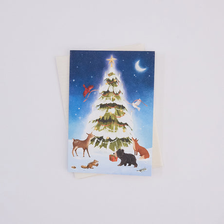 Handmade Woodland Tree Greeting Card from Craftspring, featuring a beautiful illustration of woodland animals surrounding a glowing winter Christmas tree—ethically printed in the USA on natural textured paper, perfect for sharing holiday cheer and gifting.