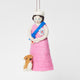 Young Queen Elizabeth II felt ornament in gala attire with a loyal corgi at her side. Handmade wool Christmas ornament honoring British royalty. Fair trade and ready to hang.