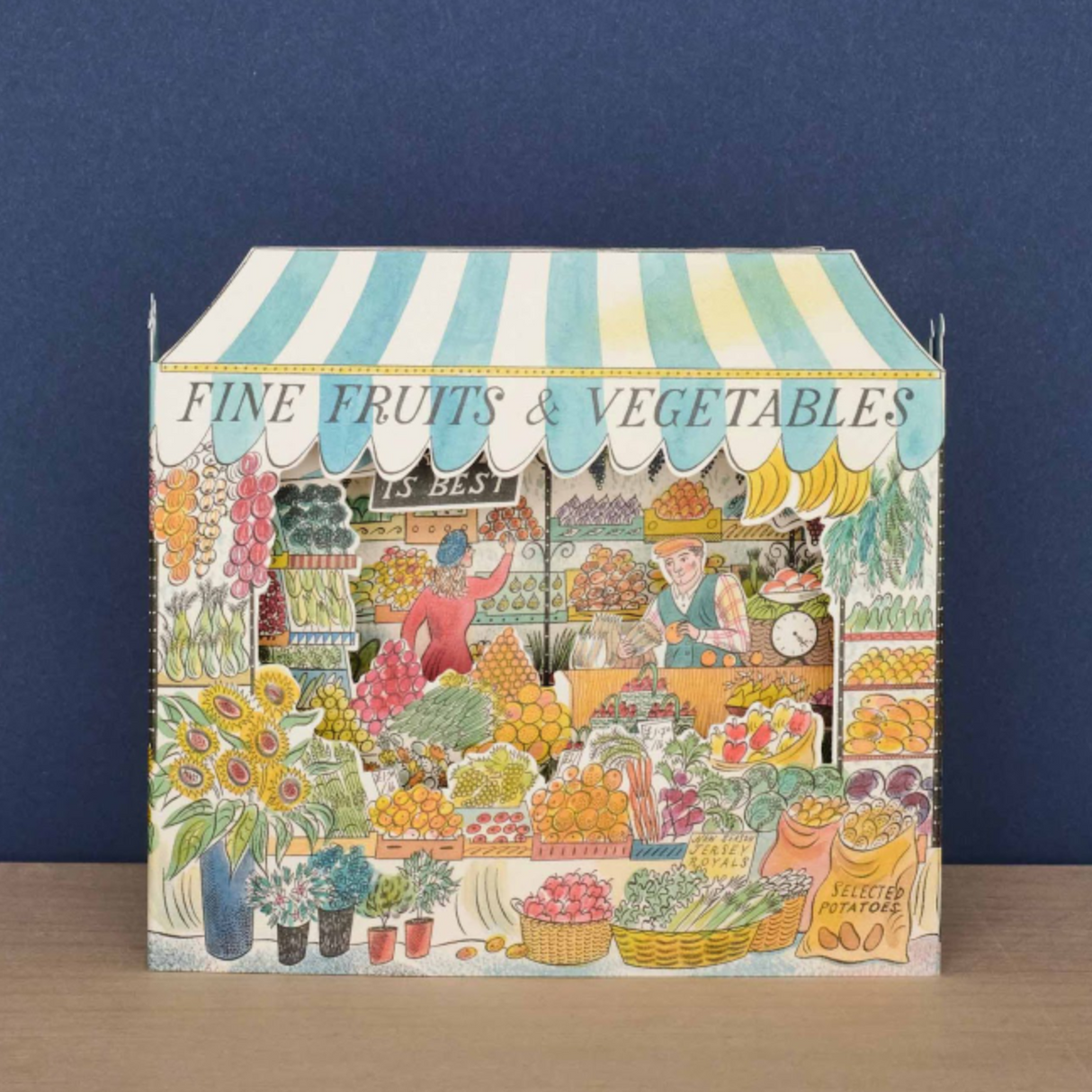 Celebrate the bounty and color of the farmer's market stall with this detailed and whimsical 3D card, illustrated by Emily Sutton. This beautiful die-cut design unfolds into a vibrant three-dimensional display of fresh produce. Peek in to discover a colorful world of painted fruits and veggies.&nbsp;