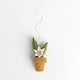 Artisan felt snake plant ornament handcrafted from merino-blend wool, celebrating the beauty and resilience of houseplants.

Hand-felted wool snake plant ornament with stitched flower details, great gift for gardeners and nature-inspired home decor.

Rustic wool felt snake plant ornament with bright green leaves and embroidered blooms, perfect for Southwest-inspired decorating.

Natural wool snake plant felt ornament with delicate stitched flowers, handcrafted and fair trade from Kyrgyzstan.
