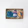 Blueberry-themed felt ornament gift set in a kraft box with crinkle paper. Includes a felt blueberry jam jar, blueberry pint basket, and blueberry pancake stack. Handmade from wool felt using traditional needle-felting. Fair trade and ready to hang.
