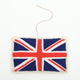 Felt British flag ornament featuring the embroidered Union Jack in red, white, and blue. Handmade from wool felt and cotton thread using traditional techniques. Fair trade and ready to hang.
