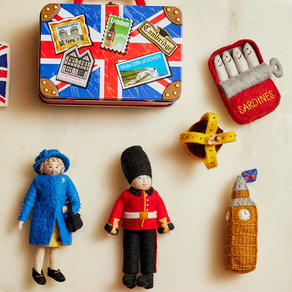 Big Ben London clock felt ornament with embroidered details and British flag topper. Handmade wool Christmas ornament inspired by UK landmarks. Fair trade and ready to hang. Also shown a Queen Elizabeth, royal guard and tin of sardine ornament