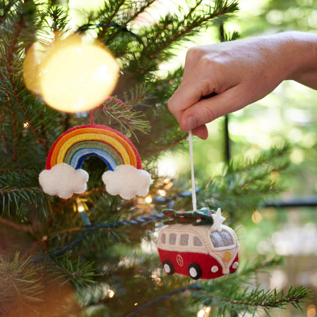 Eco-friendly handcrafted wool rainbow ornament with vivid colors, ready to hang and brighten any space with positive vibes.