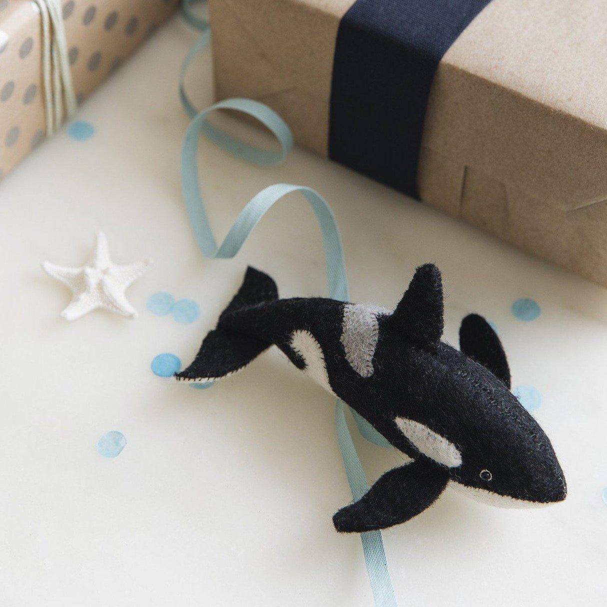A Craftspring handmade felt orca ornament