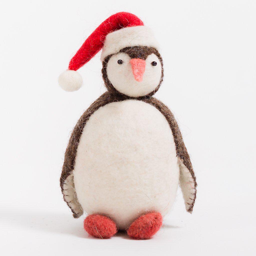 A Craftspring handmade felt santa penguin ornament wearing a santa hat