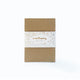 Eco-friendly candle kit sealed with gold foil label and filled with handmade joy