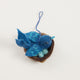 Fair trade felt Mama Bluebird ornament hanging from a botanical tree – spring-inspired handmade decor.