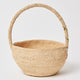 Eco-conscious handwoven raffia basket with strawberry embroidery, ideal for Easter or farmers markets.